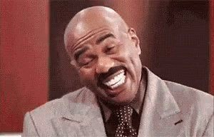 Bald Man Laughing with Mustache in Suit