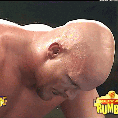 Bald Man Lying in Front of Royal Rumba Sign