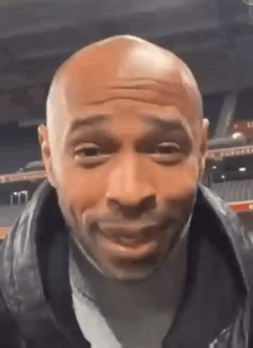 Bald Man Making Funny Face in Leather Jacket