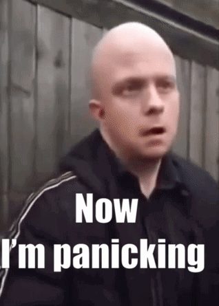 Bald Man Now I'm Panicking by Wooden Fence