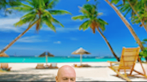 Bald Man On Beach Eyes Closed GIF
