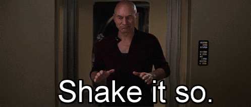 Bald Man Says Shake It So in Front of Door