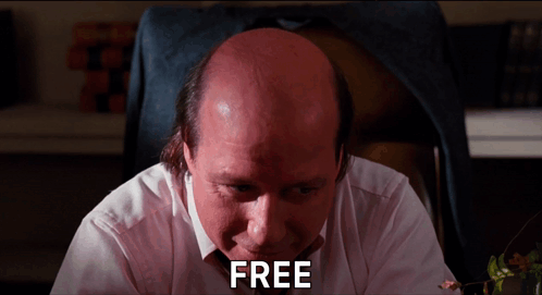 Bald Man Sitting At Desk Saying Free GIF