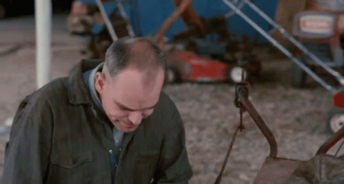 Bald Man Sitting At Diner Table GIF