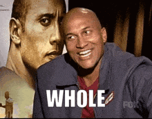 Bald Man Smiling in Front of Dwayne Johnson With Word Whole