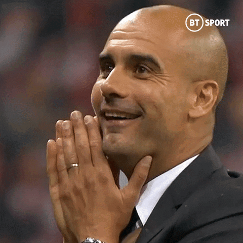 Bald Man Smiling in Suit