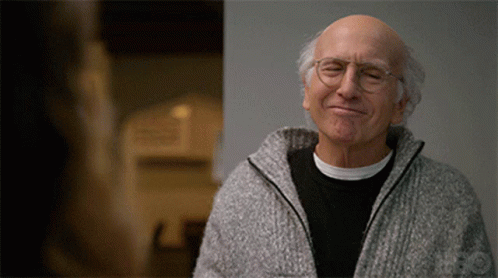 Bald Man Smiling with Eyes Closed and Glasses