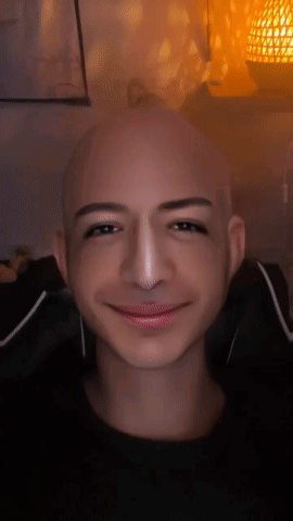 Bald Man Smiling with Nose Ring