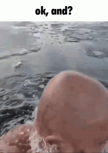 Bald Man Swimming With Ok And ? Above