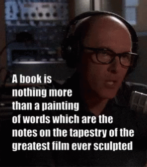 Bald Man Talking on Microphone With Headphones Glasses
