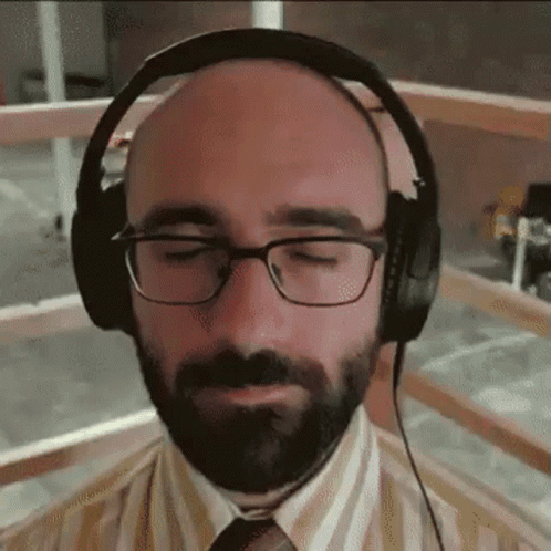 Bald Man With Beard And Glasses Wearing Headphones GIF