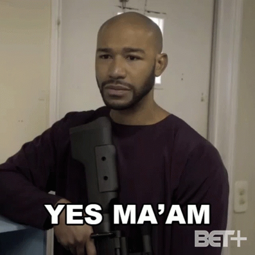 Bald Man With Beard Holding Gun