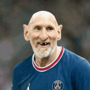 Bald Man with Beard in Blue Soccer Jersey