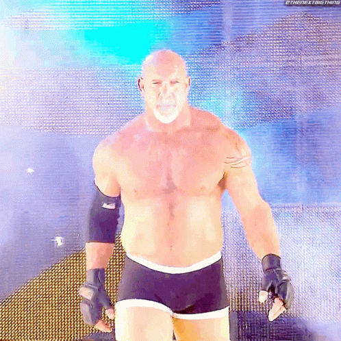 Bald Man With Beard in Front of Blue Background