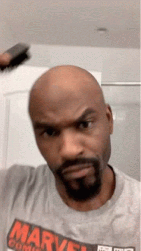 Bald Man With Beard in Gray Marvel Shirt