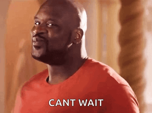 Bald Man With Beard in Red Shirt Saying Cant Wait