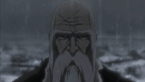 Bald Man With Beard Looking at Camera in Rain