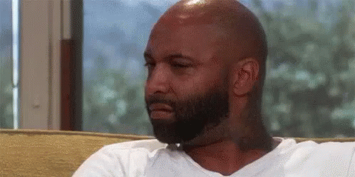 Bald Man With Beard Making Face