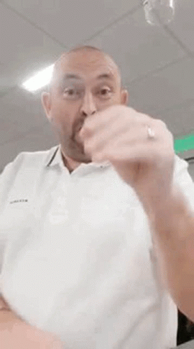 Bald Man With Beard Making Funny Face in White Shirt