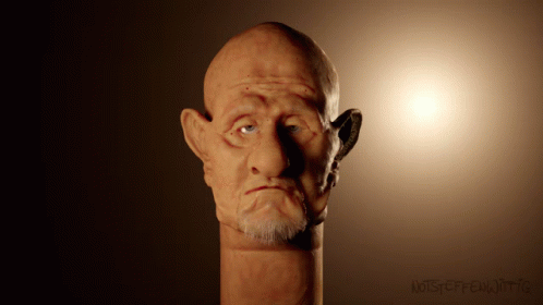 Bald Man With Beard Statue Saying Noiseeffectoiitic GIF