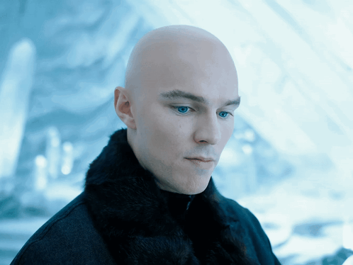 Bald Man with Blue Eyes in Black Coat