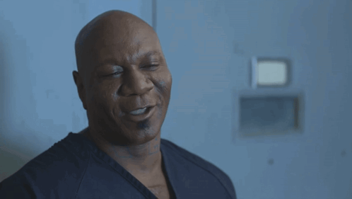 Bald Man with Eyes Closed in Black Shirt