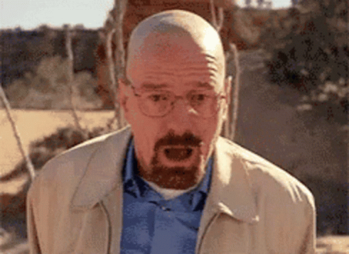 Bald Man With Glasses and Beard Making Funny Face
