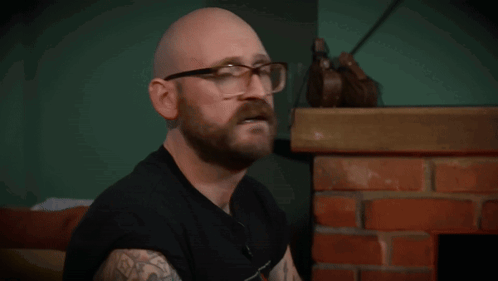 Bald Man With Glasses And Beard Says D GIF