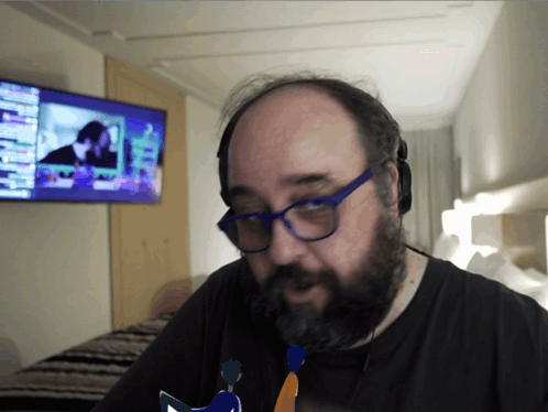 Bald Man With Glasses and Beard Watching TV