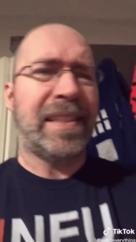 Bald Man With Glasses and Beard Wearing Neu Shirt