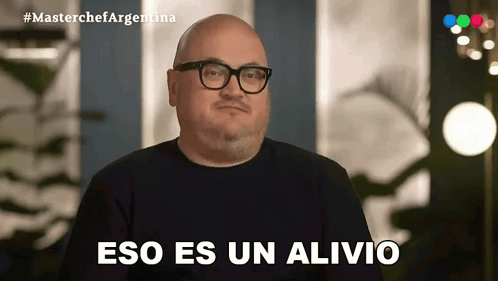 Bald Man With Glasses and Black Shirt Says Eso Es Un Alivio