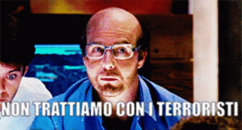 Bald Man With Glasses In Blue Shirt Says Non Trattiamo Con I Terroristi GIF