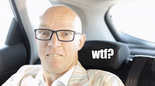 Bald Man With Glasses in Car With WTF Sticker