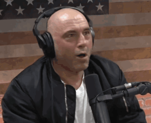 Bald Man With Headphones, Black Jacket And Microphone GIF