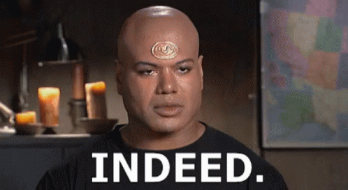 Bald Man With Medallion Says Indeed
