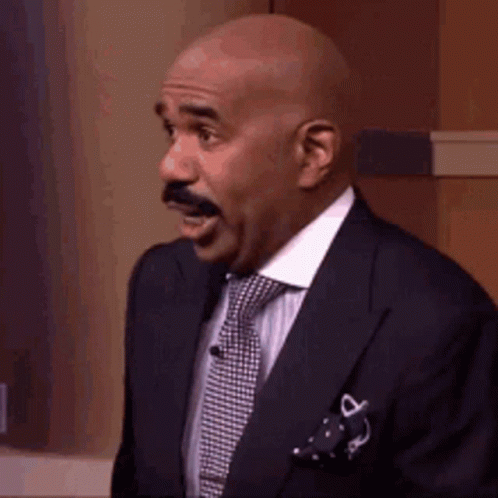 Bald Man With Mustache In Suit And Tie GIF