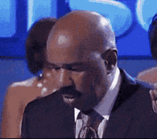 Bald Man With Mustache In Suit And Tie GIF