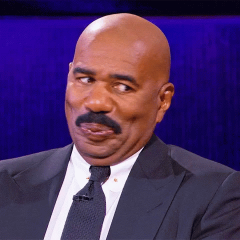 Bald Man With Mustache in Suit Making Funny Face