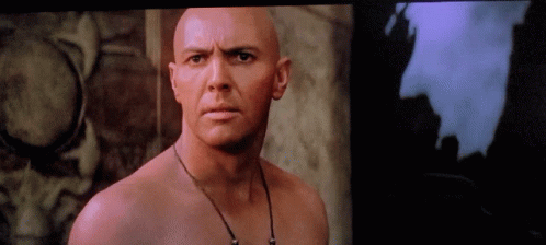 Bald Man With Necklace Looking