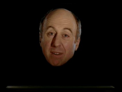 Bald Man With Sickbags On Standby Behind Him