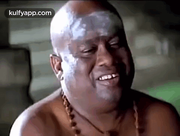 Bald Man With White Paint On Face Smiling And Laughing GIF