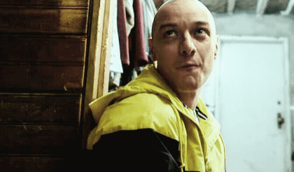 Bald Man Yellow Jacket Looks Up