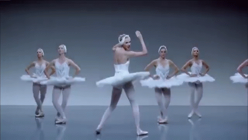 Ballerinas Dancing in a Row on Stage