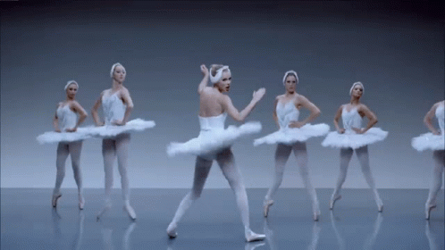 Ballerinas In White Tutus Dancing On Stage GIF