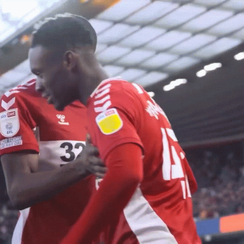 Balogun Hugging Teammates GIF