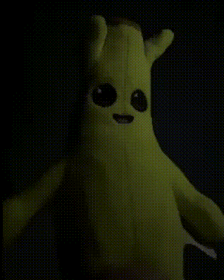 Banana Stuffed Animal With Big Eyes Glowing In Dark GIF