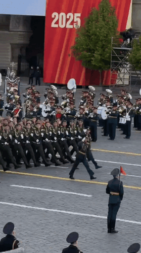 Band Marching in Front of 2025 Sign