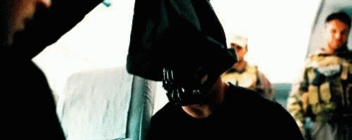 Bane Removes Face Covering GIF