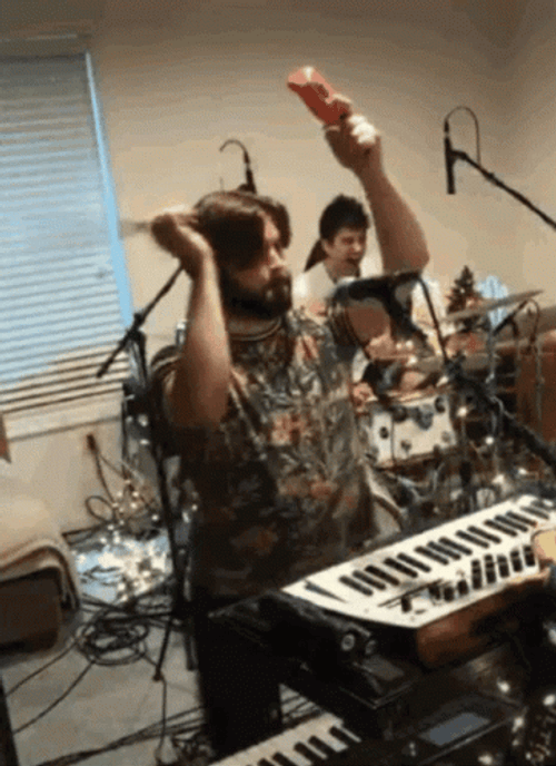 Banging Cowbell With Dance Moves GIF