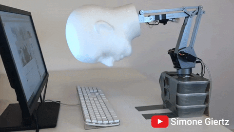 Banging Robot Head On Desk GIF
